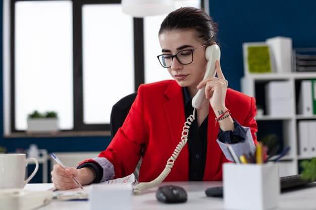 A Women trying to connect a call someone